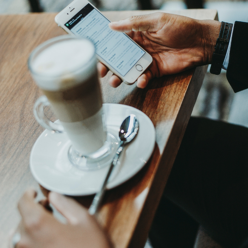 Man looking at email marketing campaign on an iphone