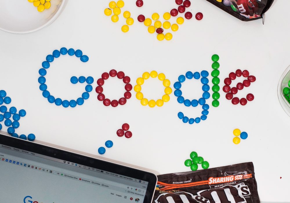 Google spelled out in candy on a desk
