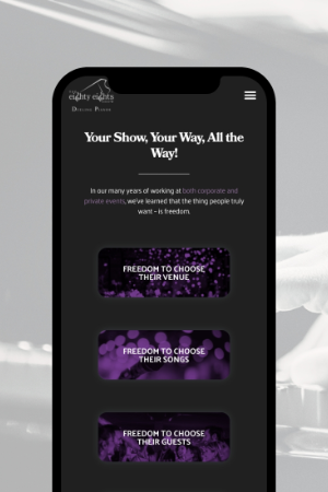 The Eighty Eights Show website mockup on a cell phone