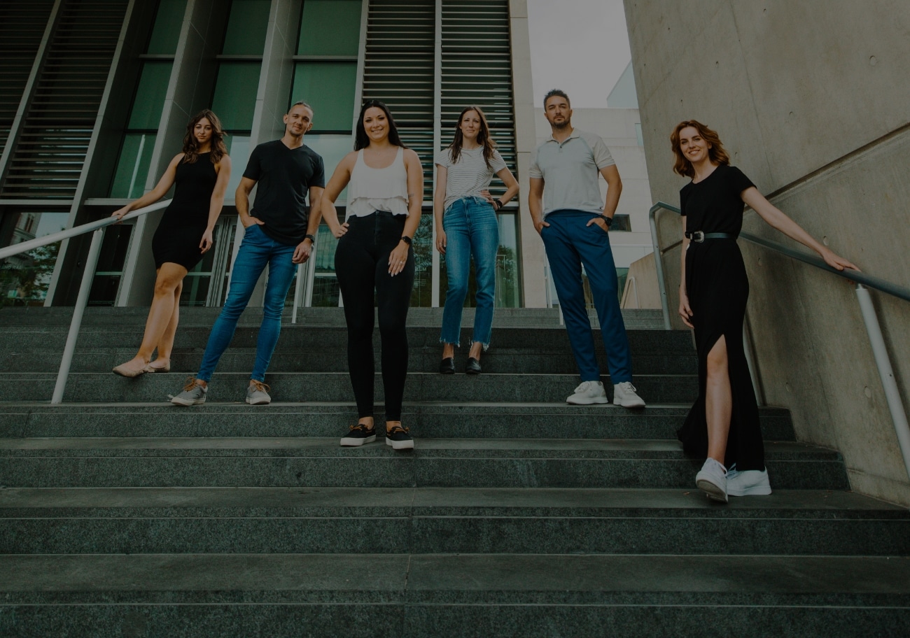 JSL Team photo on the steps of a building