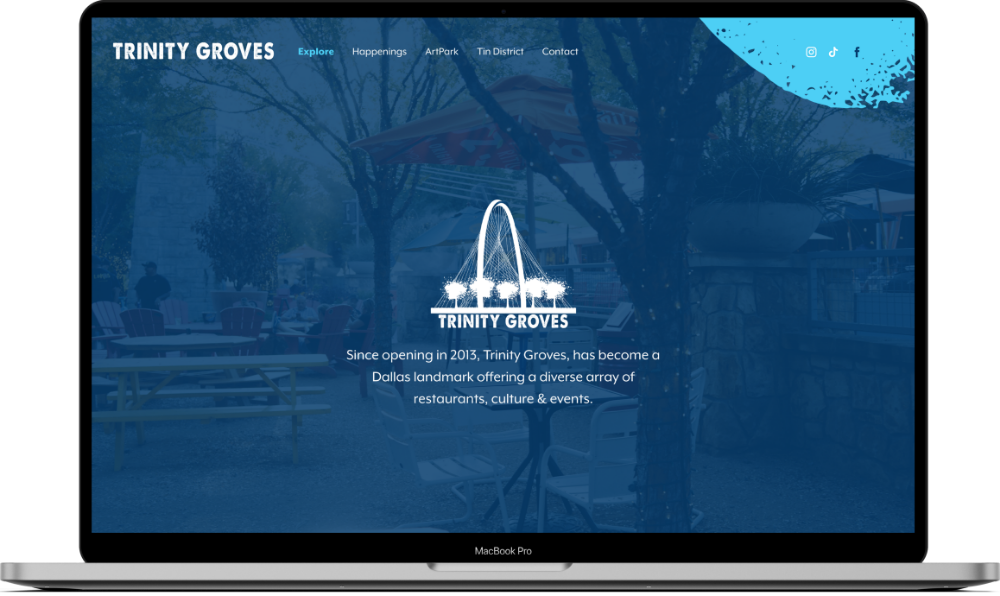 web design mockup of trinity groves website on a macbook